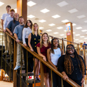 Staff posing on the steps of the Thomas Cooper Library