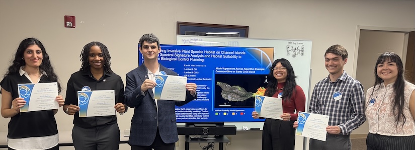 Jack Jeffrey and his team members stand in front of their poster during NASA’s EarthRISE internship program, with each team member holding an award, in summer 2026.