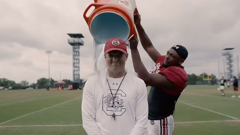 Frame of Shane Beamer participating in the ice bucket challenge.
